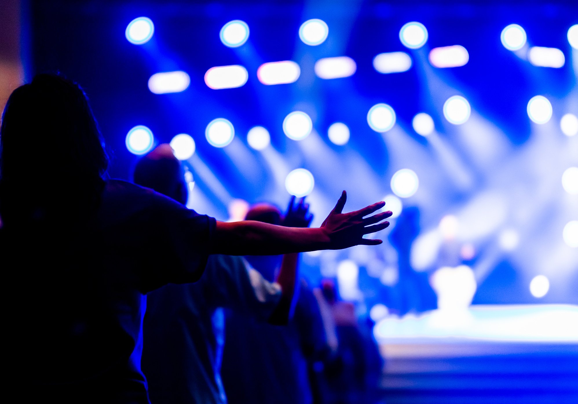 People Raising Hands during Christian Concert 